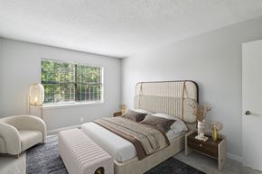 Madison apartment for rent - A bedroom with a large bed and a chair.