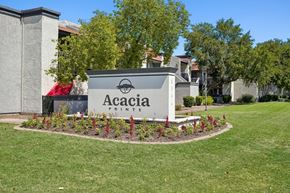 Glendale apartment for rent - A sign that says Acacia Pointe in front of a building.