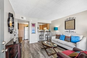 Glendale apartment for rent - A living room with a white couch and a coffee table.