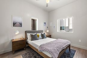 Mesa apartment for rent - a bedroom with a bed and two windows at SECOND AVE COMMONS | BRAND-NEW, Arizona