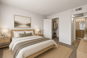 Glendale apartment for rent - A bedroom with a large bed and a painting on the wall.
