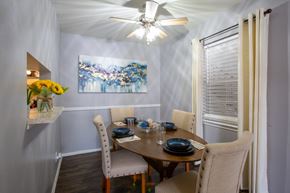 San Antonio apartment for rent - A dining room with a table set for two and a painting on the wall.