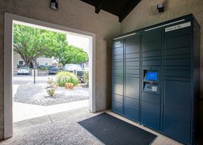 Austin apartment for rent - A parking garage entrance with a sign that says "Villas of QC".
