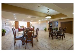 Tucson apartment for rent - A dining room with a table set for six.