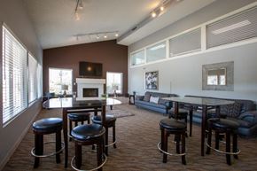 Tucson apartment for rent - A living room with a fireplace and a couch.