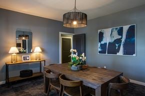Goodlettsville apartment for rent - A dining room with a wooden table and chairs.