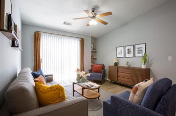 Goodlettsville apartment for rent - A living room with a grey couch and a blue couch.
