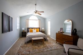Goodlettsville apartment for rent - A bedroom with a bed, dresser, and mirror.
