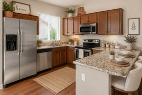 Tucson apartment for rent - A kitchen with a granite countertop and stainless steel appliances.