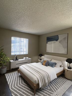 Gilbert apartment for rent - a bedroom with a bed and a dresser and a window