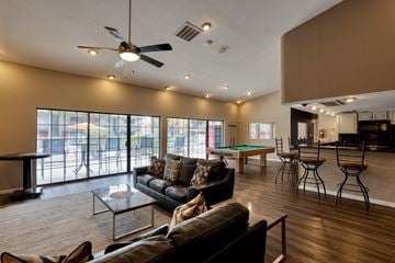 Albuquerque apartment for rent - A living room with a pool table and a bar area.