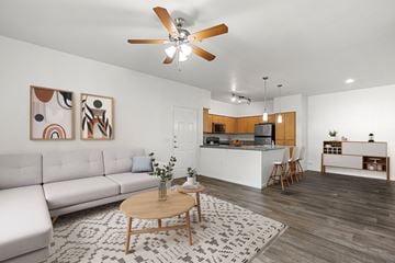 Goodyear apartment for rent - A living room with a white couch and a wooden coffee table.