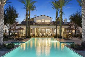 Mesa apartment for rent - A large house with a pool in the backyard.