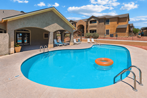 Bullhead City apartment for rent - A swimming pool with a blue water and orange ring in the middle.