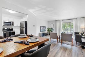 Pompano Beach apartment for rent - A modern kitchen with a dining table set for two.