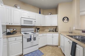Avondale apartment for rent - A kitchen with white cabinets and appliances.