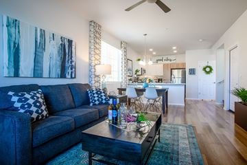 Chandler apartment for rent - a living room with a blue couch and a coffee table