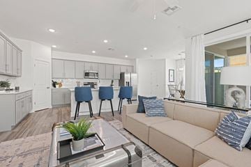 Phoenix townhouse for rent - A modern living room with a beige couch and a coffee table.