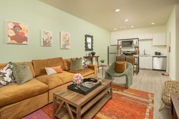 Phoenix apartment for rent - a living room with a brown couch and a coffee table