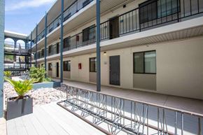 Tucson apartment for rent - A building with a balcony and a bike rack