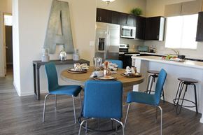 Tucson apartment for rent - A kitchen with a dining table and chairs.