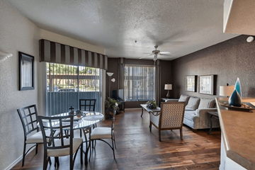 Goodyear apartment for rent - a living room and dining room with a table and chairs
