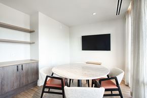 Scottsdale apartment for rent - A modern dining room with a round table and chairs.