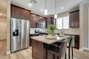 Mesa apartment for rent - Kitchen with breakfast bar at Bella Victoria Apartments in Mesa Arizona January 2021