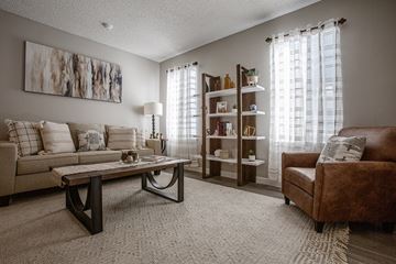 Albuquerque apartment for rent - a living room with a couch and a chair