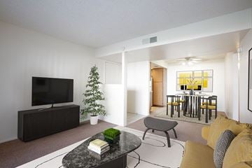 Phoenix apartment for rent - a living room and dining room with a table and a television