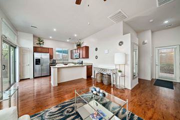 Tucson apartment for rent - an open kitchen and living room with a glass table