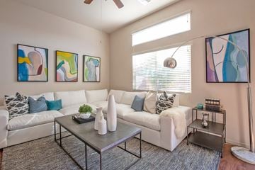 Chandler apartment for rent - a living room with couches and tables and a window