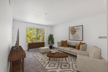 Kingman apartment for rent - a living room with a couch and a table