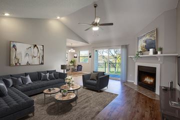 Austin apartment for rent - a living room with couches and chairs and a fireplace