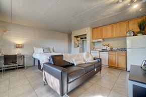Tucson apartment for rent - Living room & kitchen at University Manor Apartments in Tucson, AZ