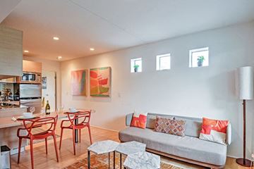 Tempe apartment for rent - a living room with a couch and a table with chairs