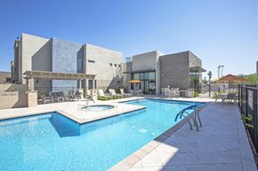 Phoenix apartment for rent - Pool and pool patio at Senderos at South Mountain in Phoenix AZ September 2020