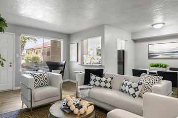 Albuquerque apartment for rent - A living room with a white couch and a coffee table.