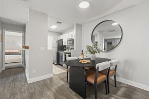 Tucson apartment for rent - A modern kitchen with a dining table and chairs.