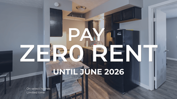 Lexington apartment for rent - A sign that says "PAY ZERO RENT UNTIL JUNE 2026" is displayed in a room with a kitchen area.
