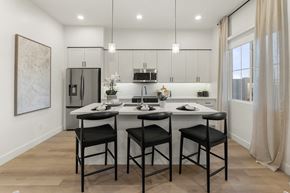 Queen Creek apartment for rent - A modern kitchen with a dining table and chairs.