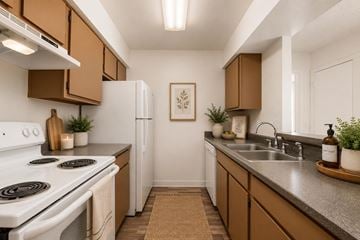 Glendale apartment for rent - A kitchen with brown cabinets and a white stove.