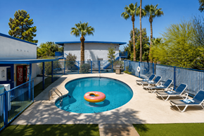 Tucson apartment for rent - A pool with a blue fence and a red inflatable ring.
