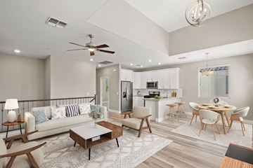 Mesa apartment for rent - a living room with a couch and a table with chairs