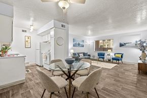 Tucson apartment for rent - A modern kitchen with a dining table and chairs.