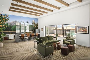 Mesa apartment for rent - A living room with a green couch and a wooden floor.