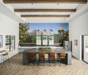 Mesa apartment for rent - A kitchen with a large table and chairs with a picture of a house on the wall.