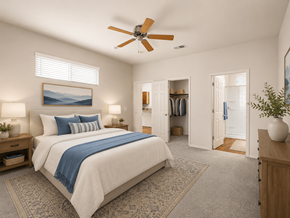 Tucson apartment for rent - A bedroom with a large bed and a ceiling fan.