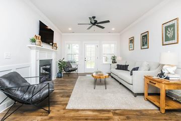 Thompson Station apartment for rent - A living room with a black chair and a white couch.