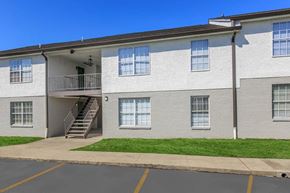 Murfreesboro apartment for rent - A building with a parking lot in front.